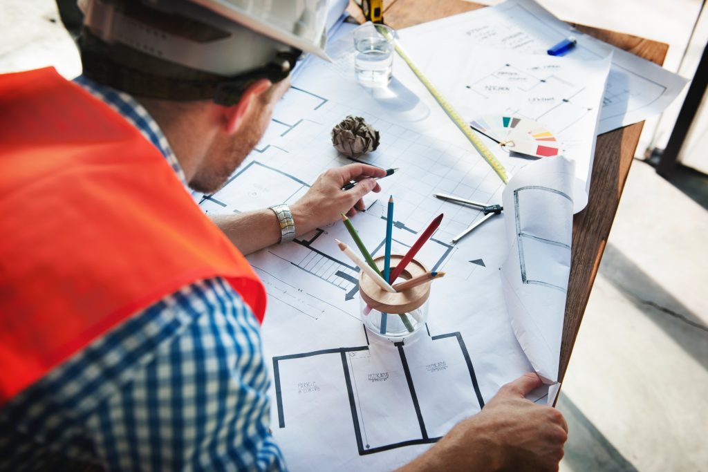 Project Manager Examining Building Plans